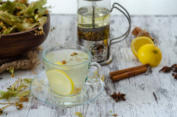 Linden and linden tea. Herbal tea made from linden. Detox herbal tea on wooden table.