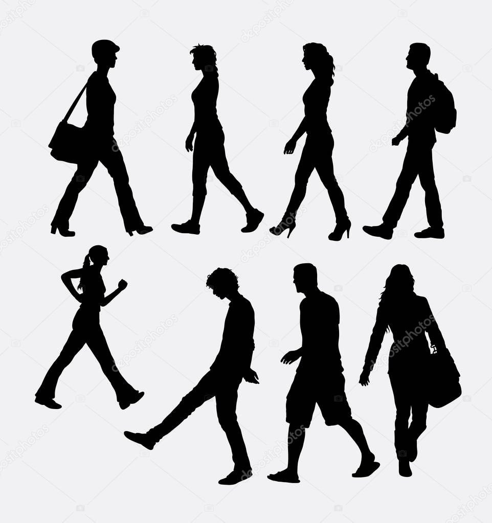 People male and female walking silhouette. Good use foe symbol, logo, web icon, sticker design, sign, mascot, or any design you want. Easy to use.