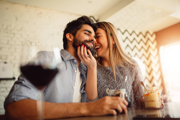 Couple laughing and enjoy their moments in cafe.