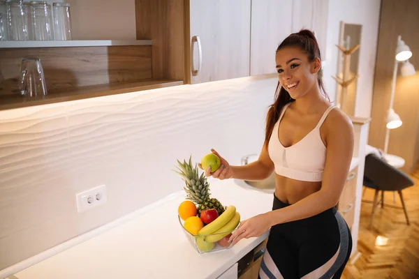 Young fit girl eating healthy food.