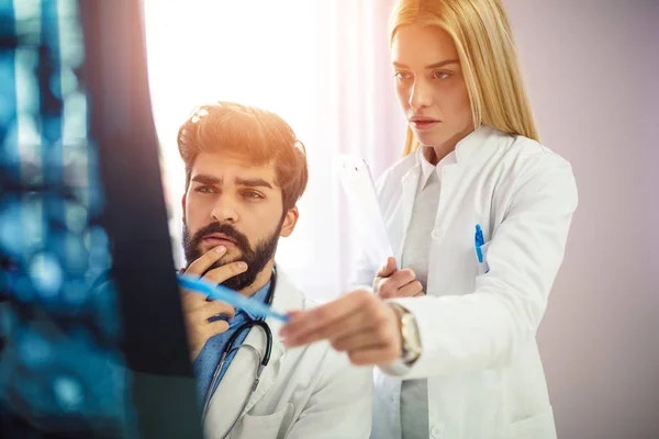 Two Serious Doctors Reviewing Patient Medical Results Doctors Looking Ray — Stock Photo, Image