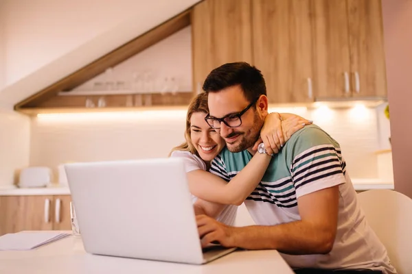 Young Man Glasses Working His Laptop While His Girlfriend Hugging — Stock Photo, Image