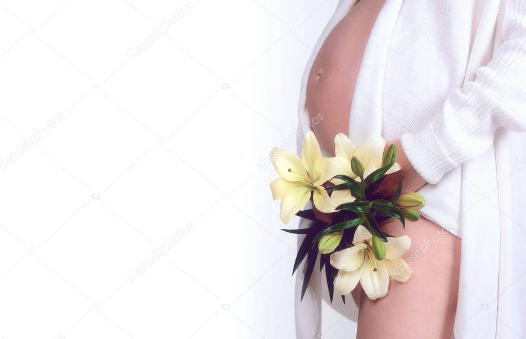 Pregnant belly close up, flowers in front of vagina, isolated