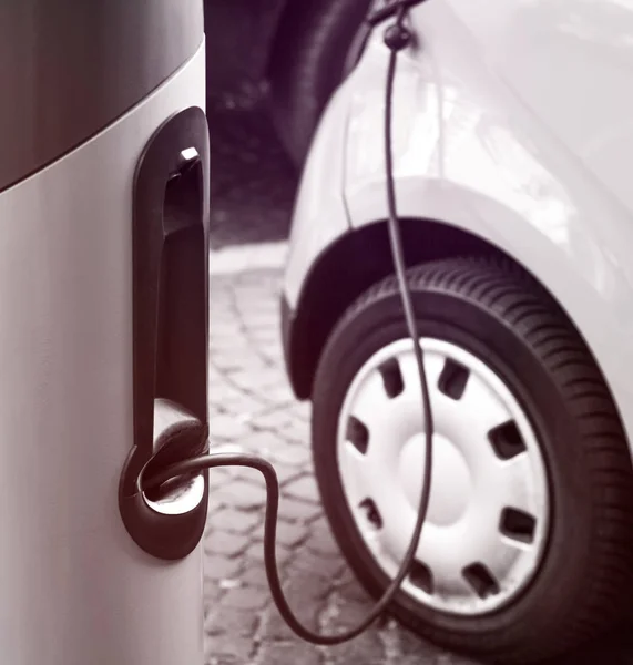 Refueling gun at electric vehicle charging station