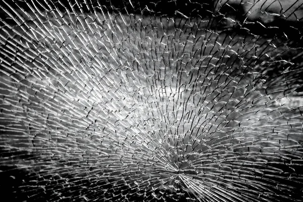 Broken glass texture dark background, close-up view — Stock Photo, Image