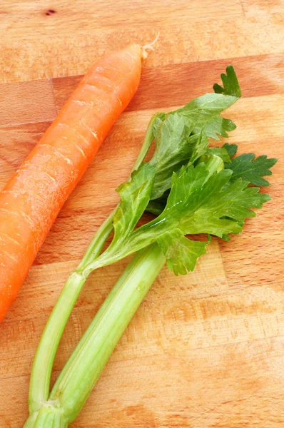 Stalk of celery and carrot, ready to prepare a Italian mirepoix, — Stock Photo, Image