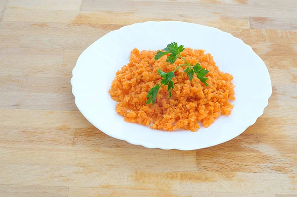 Minced orange carrot and parsley in a dish — Stock Photo, Image