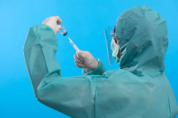 Medical doctor or laborant holding tube with nCoV Coronavirus vaccine for 2019-nCoV COVID virus. Novel Coronavirus originating in Wuhan, China. Coronavirus 2019-nCoV COVID