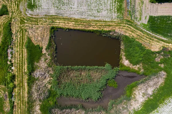 Early spring aerial landscape with fields of Poland. Typical polish landscape photographed from above. Aerial view of agricultural fields