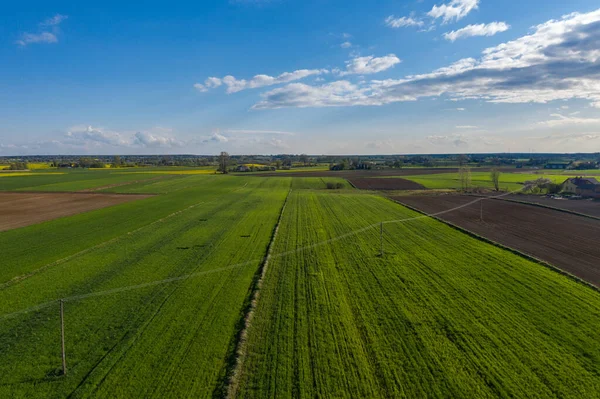 Early spring aerial landscape with fields of Poland. Typical polish landscape photographed from above. Aerial view of agricultural fields