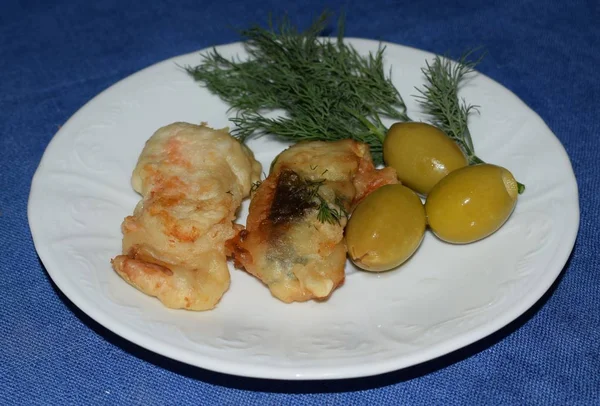 fried fish with herbs and vegetables