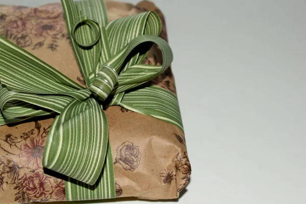 packaged gift with a bow