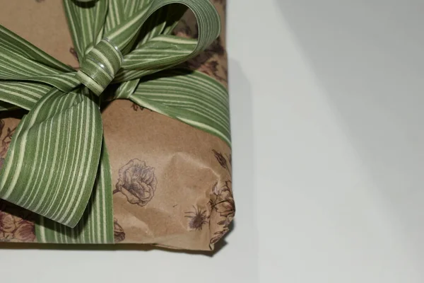 packaged gift with a bow