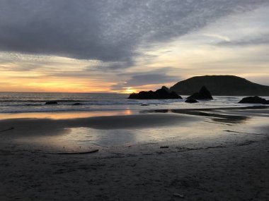 Harris Beach 'te güzel gün batımı