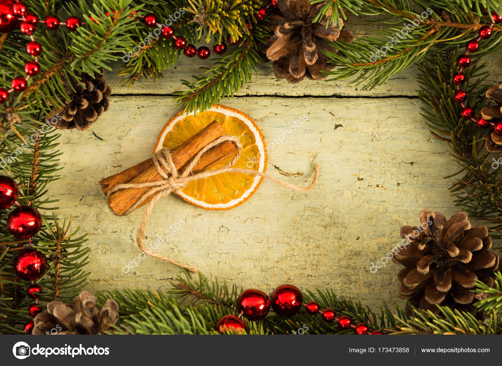 Christmas Frame Decoration And Cinnamon With Dry Orange Slice