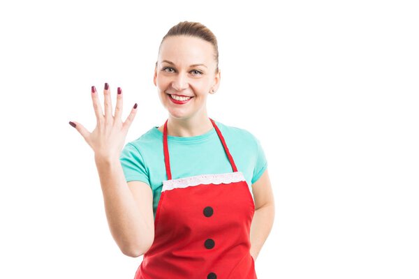 Wife wearing red apron and showing number five