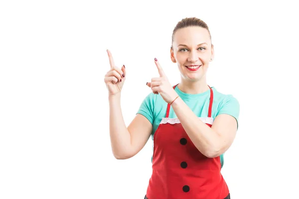 Supermarket or hipermarket employee showing and pointing up — Stock Photo, Image