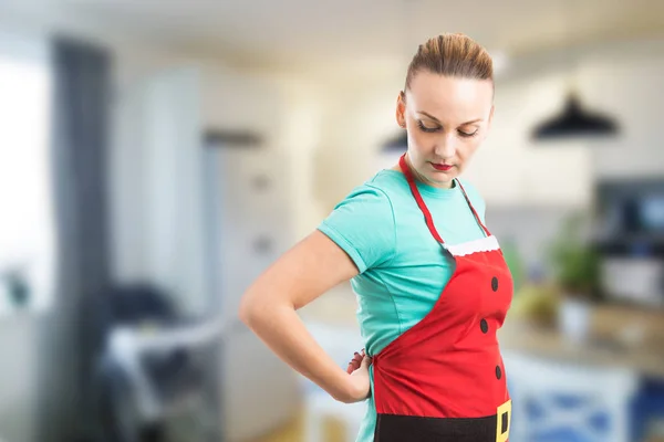 Woman tie the back knot of red Christmas apron — Stock Photo, Image