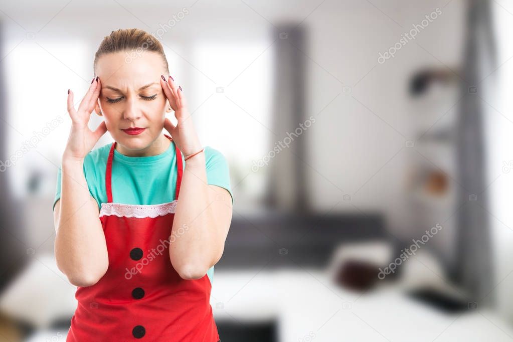 Housewife housekeeper or maid suffering a painful headache