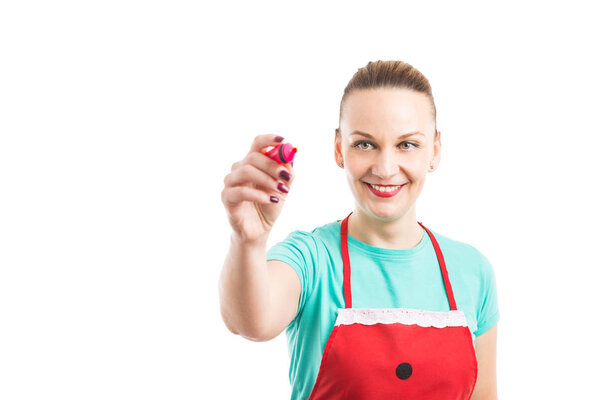 Woman wearing red apron writing on invisible screen