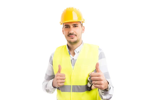 Sorrindo confiante bonito construtor mostrando duplo gosto — Fotografia de Stock