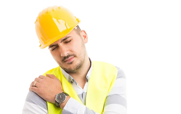 Construtor ou trabalhador da construção sofrendo dor no ombro proble — Fotografia de Stock