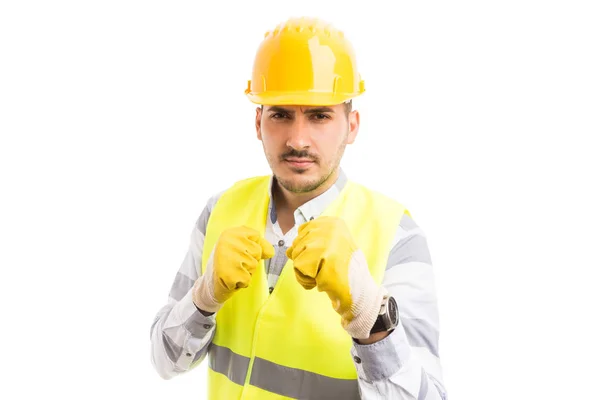 Menacing worker showing fists in aggressive mod — Stock Photo, Image