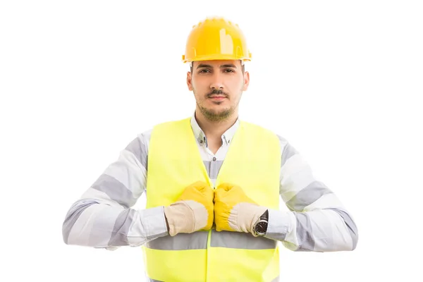 Trabalhador da construção segurando punhos juntos — Fotografia de Stock