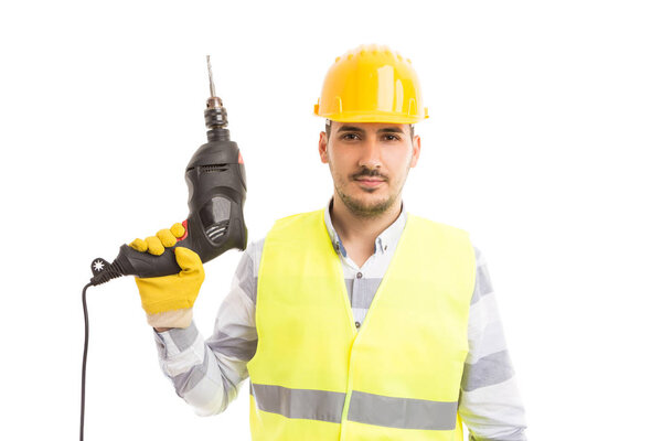 Handsome young repairman holding drilling machin