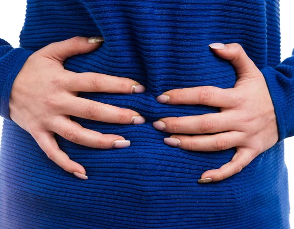 Woman hands grabbing bloated abdome — Stock Photo, Image