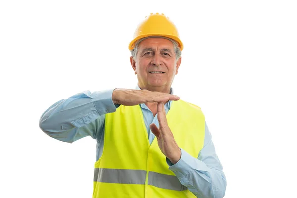 Construtor velho fazendo tempo fora gesto — Fotografia de Stock