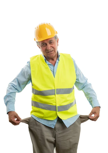 Construtor mostrando bolsos de calças — Fotografia de Stock