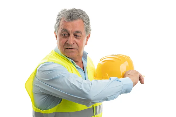 Builder throwing helmet — Stock Photo, Image