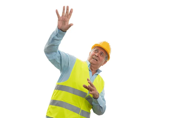 Construction worker looking up scared Stock Image