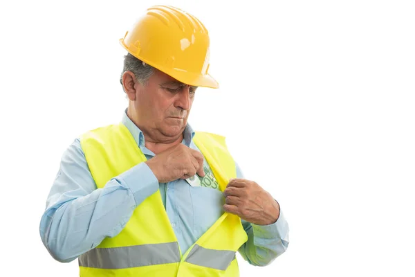 Engineer hiding money inside chest pocket