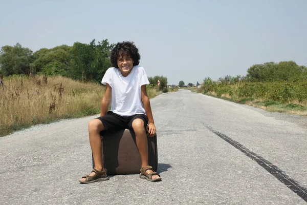 A boy with an old suitcase — Stock Photo, Image