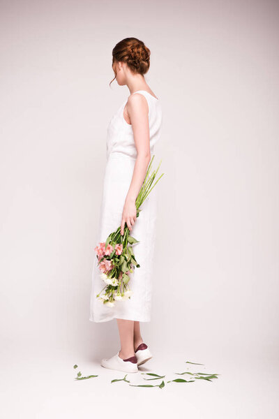 girl in white dress with flowers