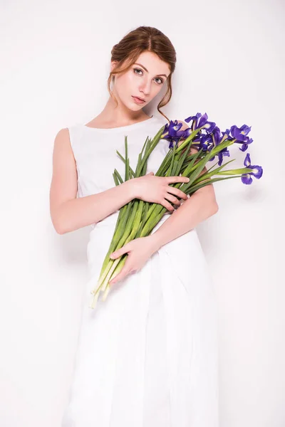 Beautiful woman with iris flowers — Stock Photo, Image