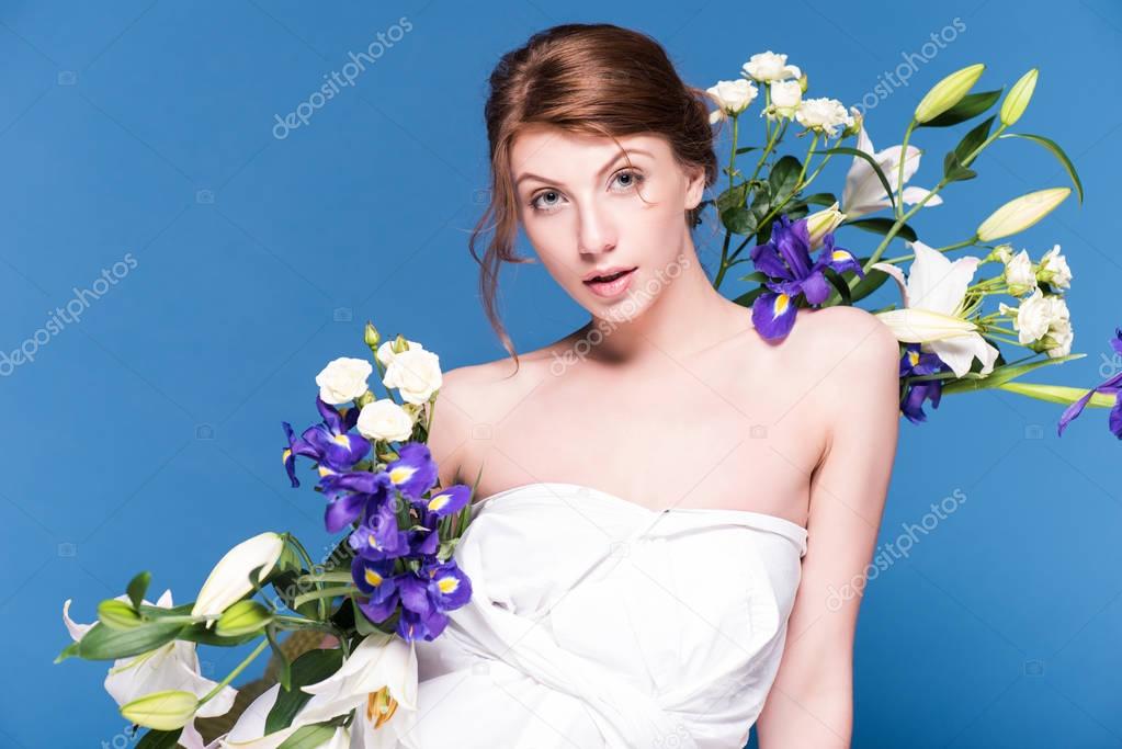 seductive young woman with flowers
