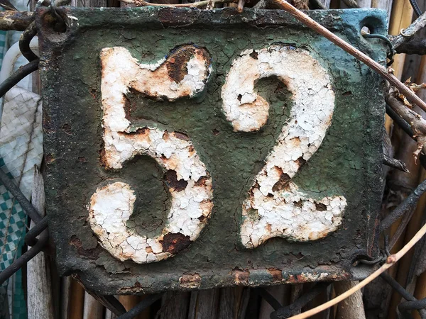 Vintage grunge square metal rusty plate of number — Stock Photo, Image