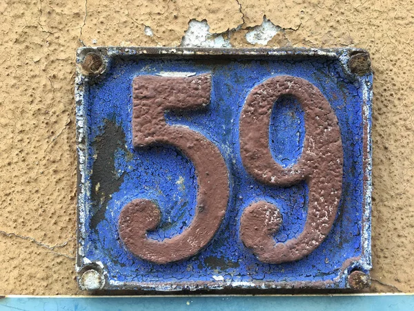 Vintage grunge square metal rusty plate of number — Stock Photo, Image