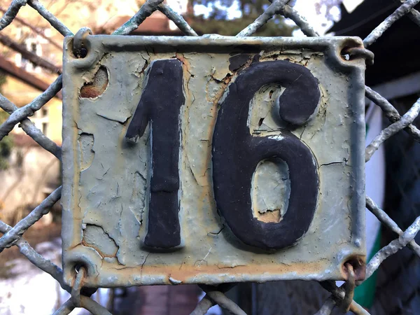 Vintage grunge square metal rusty plate of number