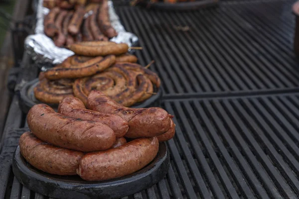 Pork sausage and hot dogs on the grill Stock Picture
