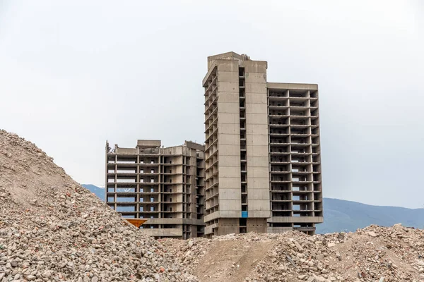 Building implodes, after series of explosions.