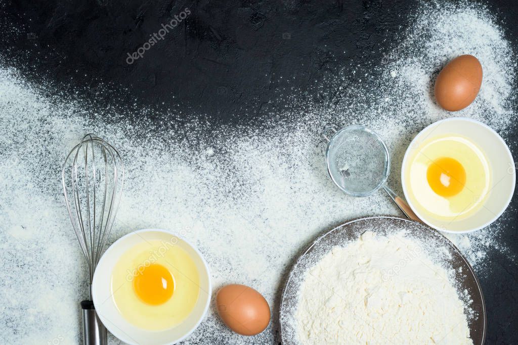 Maslenitsa is a traditional holiday in February . Ingredients for baking pancakes. frying pan, eggs, flour, egg beater, on a dark wooden background top view. top view, place to copy text, recipe.