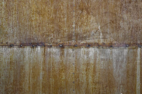 Maleri av rustent metall. Ruststruktur av metall. Erosjonsmetall. skrapt og skitten struktur på utendørs rustne metallvegger . – stockfoto