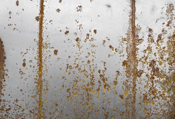 Ржавый фон из окрашенного металла. Металлическая ржавчина. Эрозионный металл. Царапанная и грязная текстура на наружной ржавой металлической стене . — стоковое фото