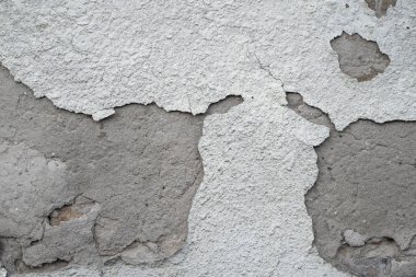 Arka planda gri çimento dokusu ile kaplı çatlak beton duvar tasarımda kullanılabilir. Çatlak ve delikli kirli beton doku..