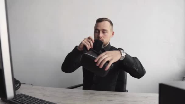 Young bearded man start using vr headset sitting against computer and trying to touch something or tap some thing in front of what he seeing. Modern technologies. The concept of future technology. — 비디오