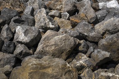Big rocks on a beach in a sunlight.